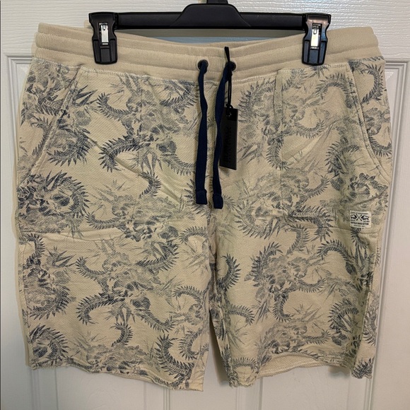 Cream shorts with blue floral design - Picture 1 of 5